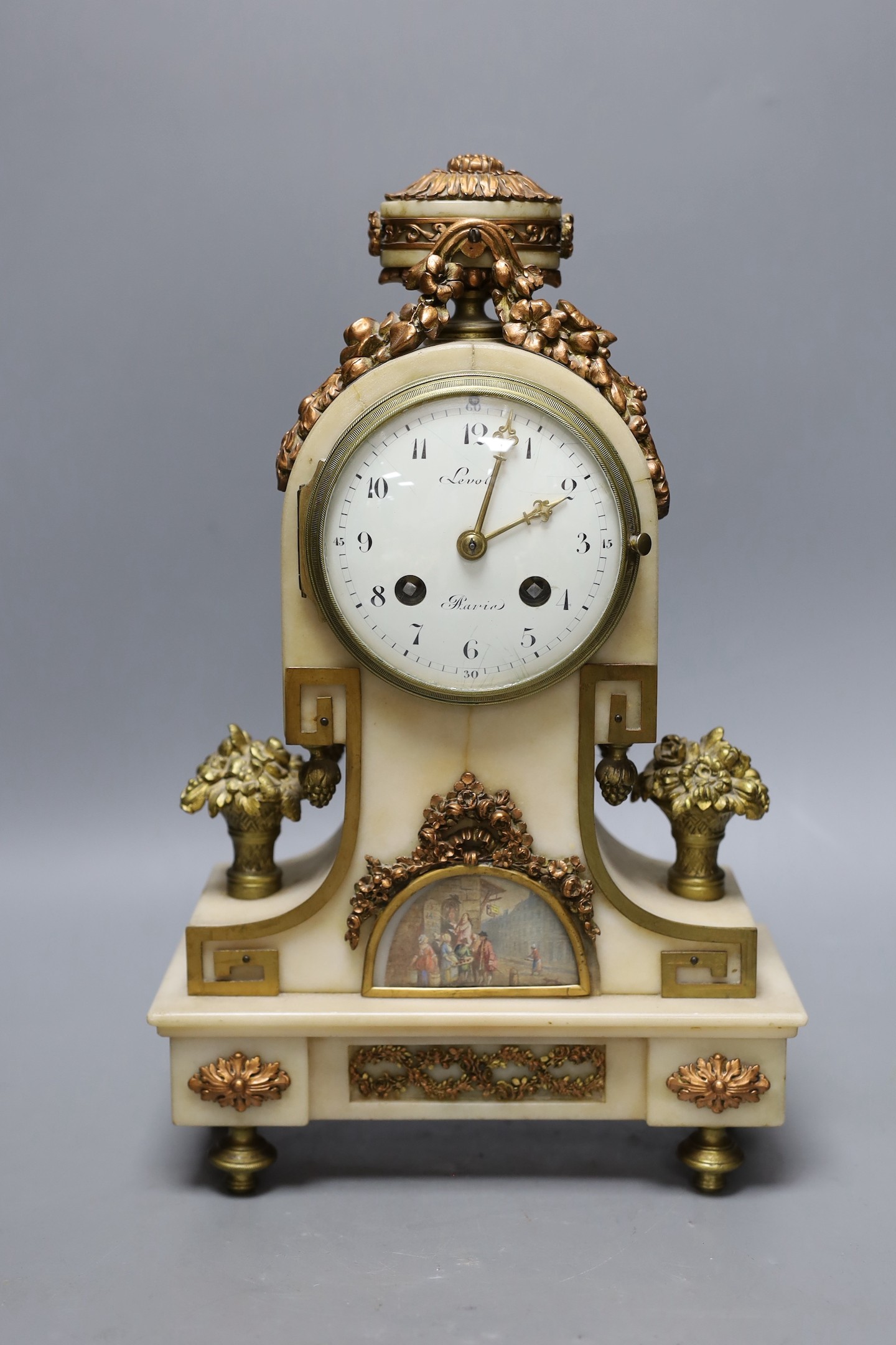 A 19th century French alabaster and phosphur bronze mounted mantel clock with a painted demi lune inset. 33cm tall